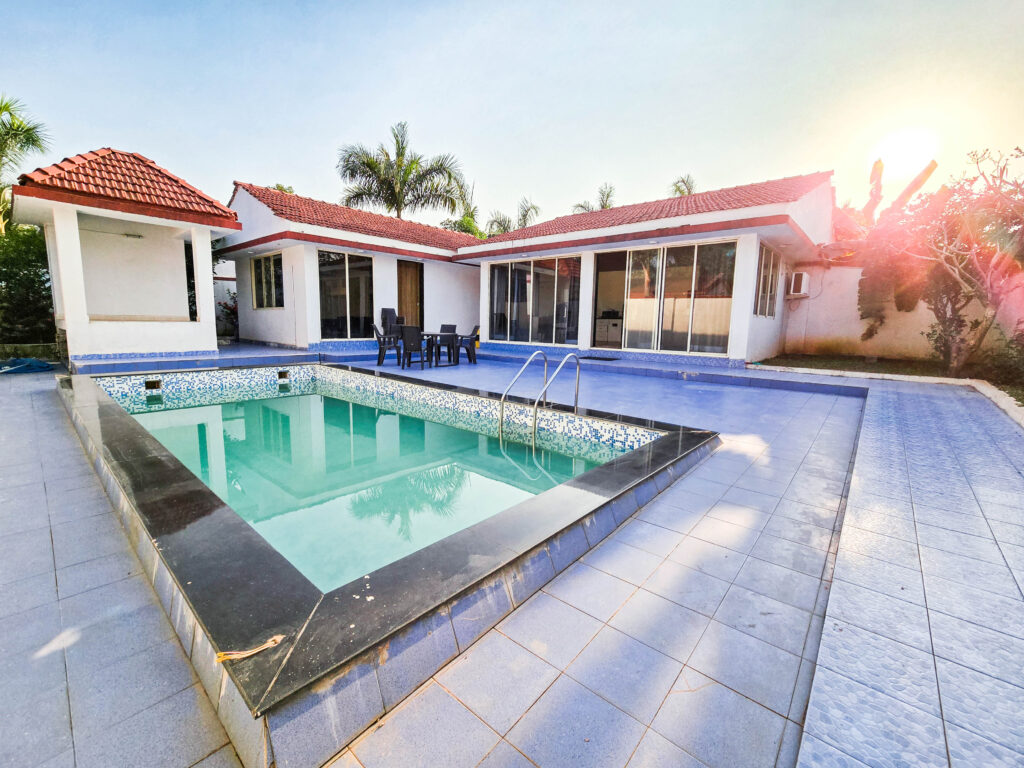 Sihra Villa, Neral: The pool and villa in late-afternoon sun