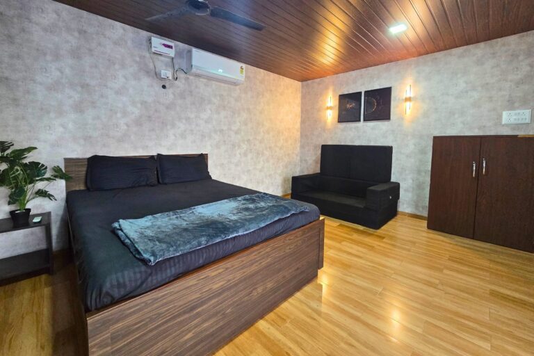 Sihra Villa, Neral: The AC bedroom, with bed, sofa-cum-bed and wardrobe